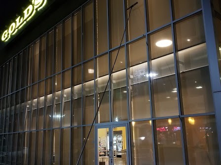 Commercial window cleaning at a Gold's Gym property