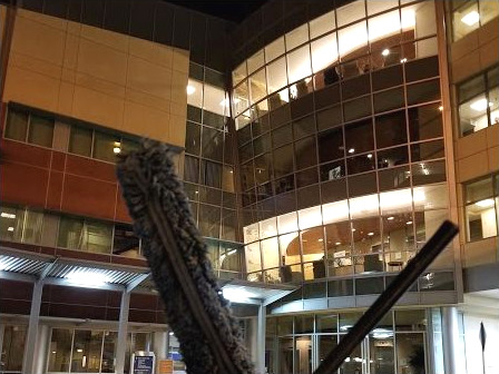 Commercial atrium window cleaning with water-fed poles in Orange County