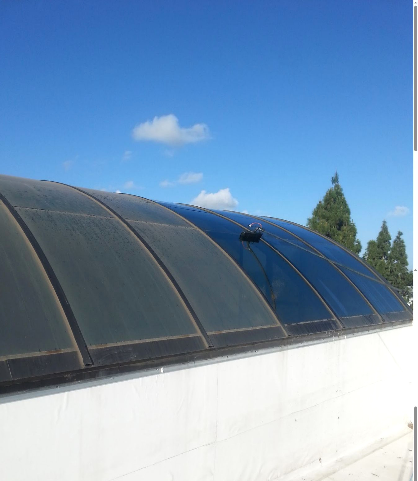 Commercial skylight panels showing the cleaning process and surface condition