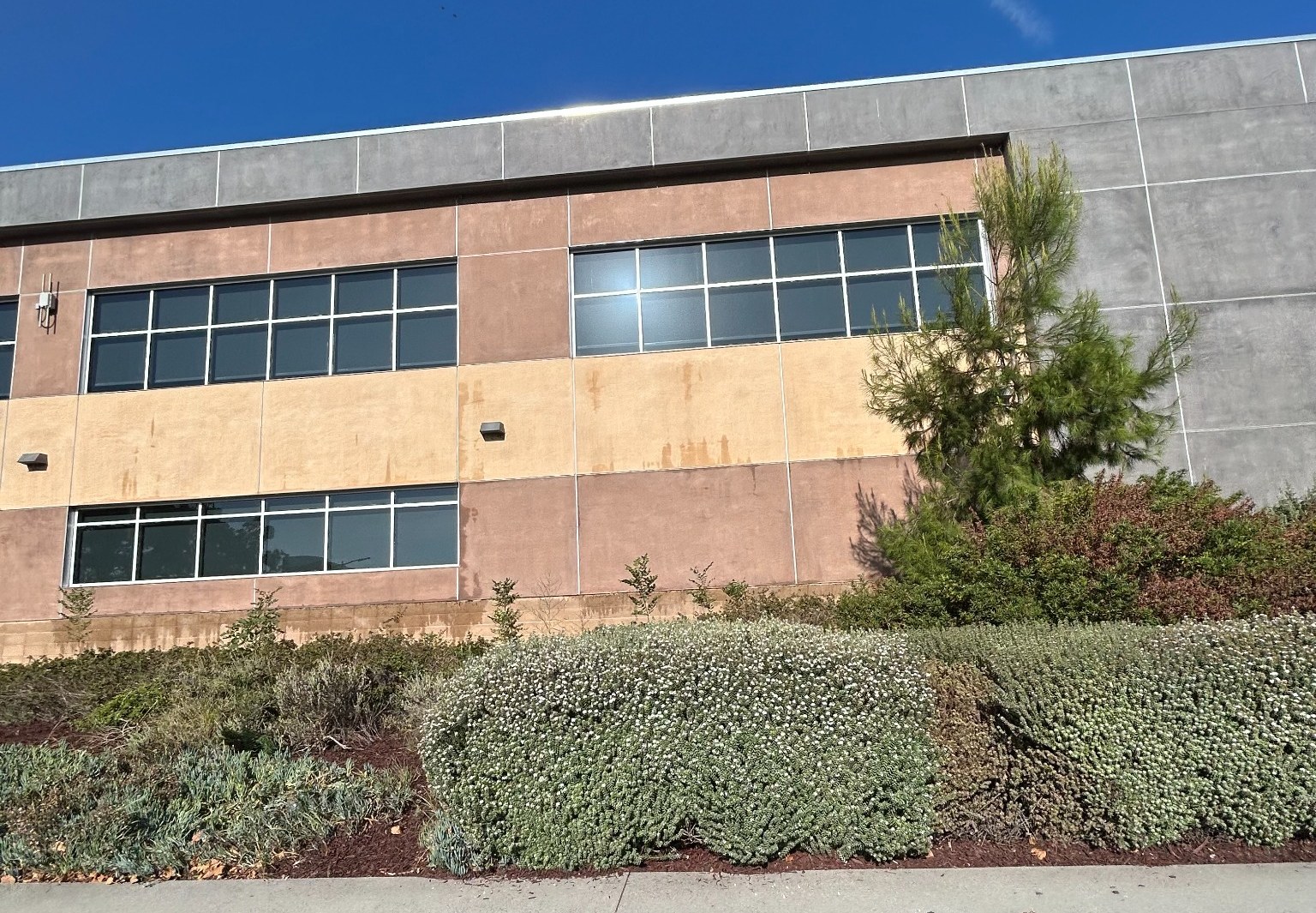 Exterior windows on a multi-story college building in Huntington Beach.